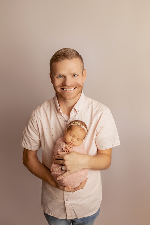 dad holding newborn baby photograph pensacola